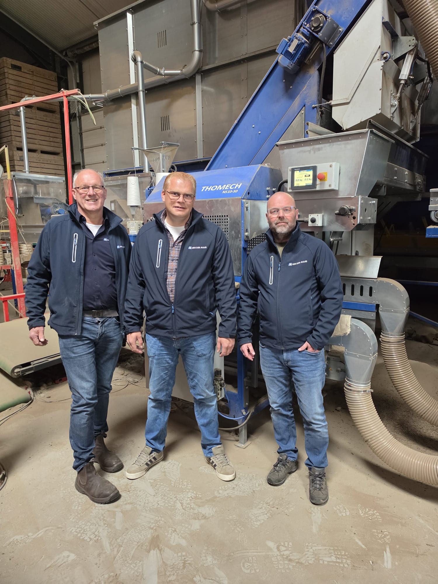 Team Van der Maar bij een Verbruggen machine